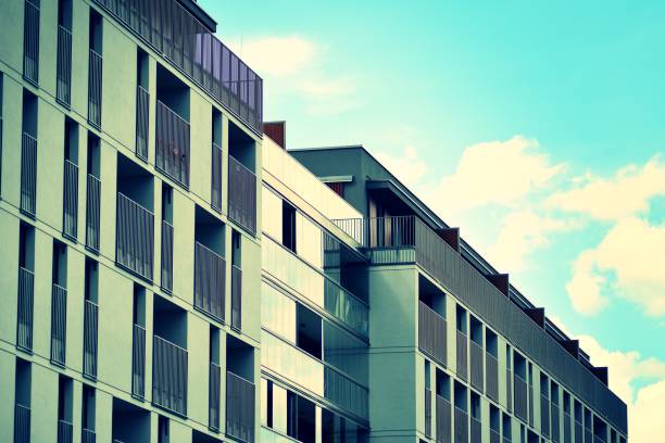 istock Modern apartment building exterior. Retro colors stylization 1024340116