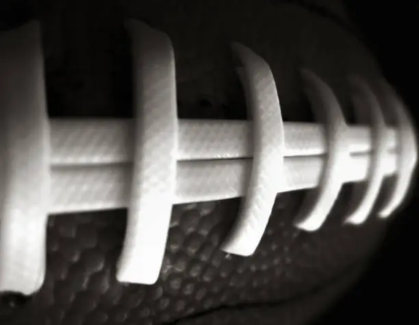 Black and White Close-up of American Football Laces