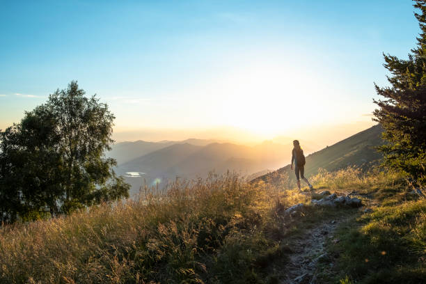 istock Hiker woman solo on mountain during sunrise 1024367022