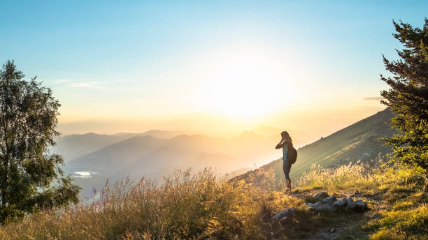istock Hiker woman solo on mountain during sunrise 1024367036