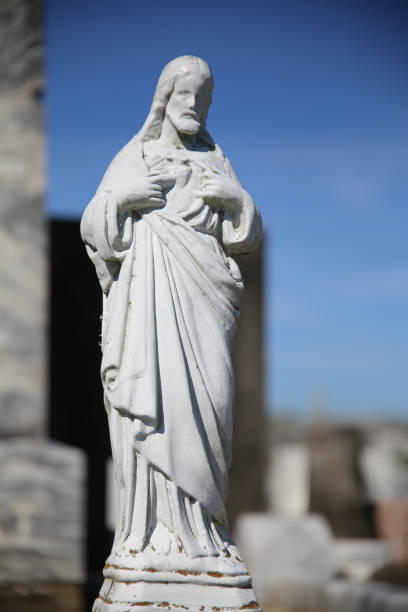 istock Sacred Heart Jesus Statue in Cemetery 1024370888