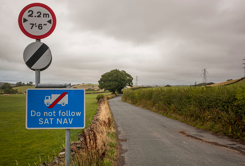 Do not follow SATNAV sign alongside a national speed limit sign in the UK
