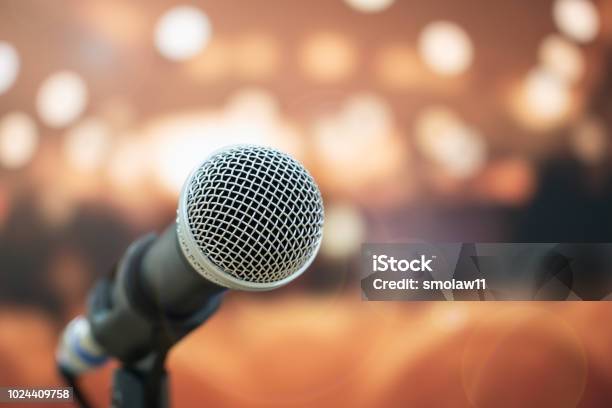 Seminar Conference Concept Closeup Microphones On Abstract Blurred Of Speech In Meeting Room Front Speaking Blur People In Event Convention Hall With Lens Light Flare In Hotel Background Stock Photo - Download Image Now