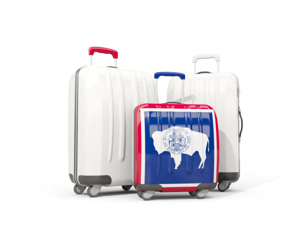 luggage with flag of wyoming. three bags with united states local flags - suitcase flag national flag isolated on white imagens e fotografias de stock