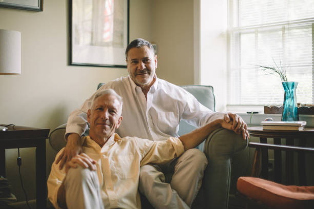 loving middle aged gay couple stock photo