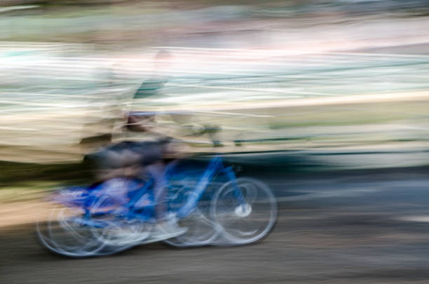 istock Motion blur of a cyclist passing by during summer day 1024444410