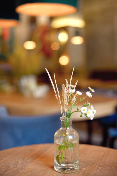 istock decorative bottle vase with flowers on the table 1024454968