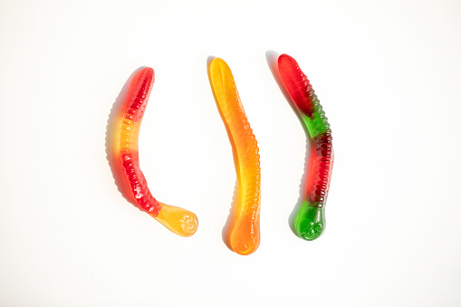 Gummy worms candy on a white background
