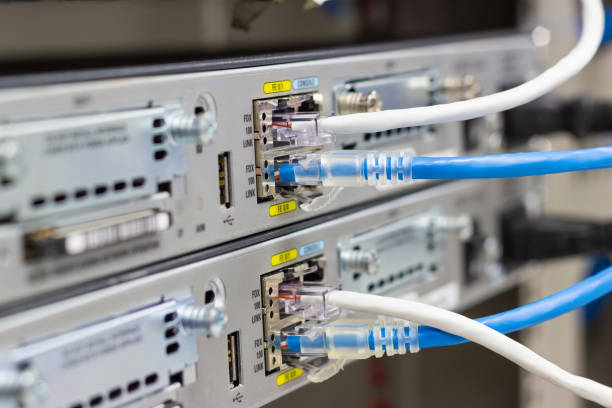 istock Network switch in rack, network cables connect SFP module port in the Datacenter room. 1024483512
