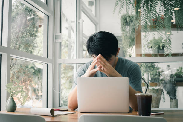 Freelancer man working online at his home. stock photo