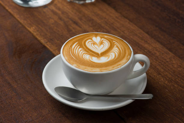 istock A Cup of hot latte art coffee on wooden table 1024490446