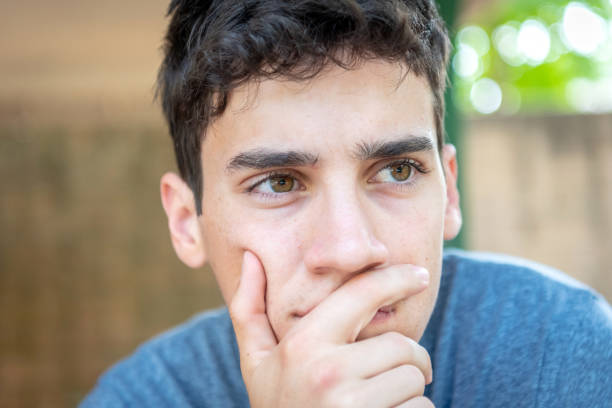 Pensive Young caucasian man looking away