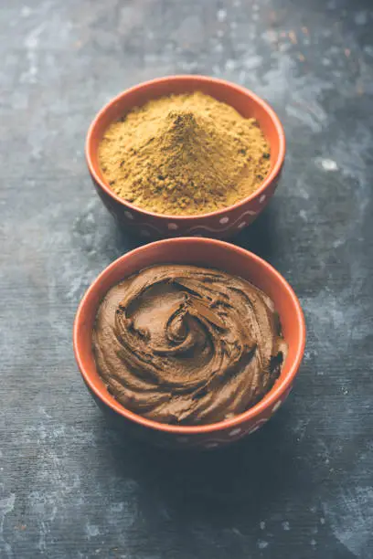 Henna / Mehandi powder and paste. Prepared for Hair colouring or for tattoo on hand in Indian weddings/festivals. selective focus