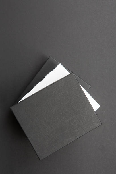 istock Black and white polka dot gift box on a dark contrasted background, creating a romantic atmosphere. Typically used for birthday, anniversary presents, gift cards, post cards. 1024514132