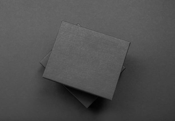 istock Black and white polka dot gift box on a dark contrasted background, creating a romantic atmosphere. Typically used for birthday, anniversary presents, gift cards, post cards. 1024514226
