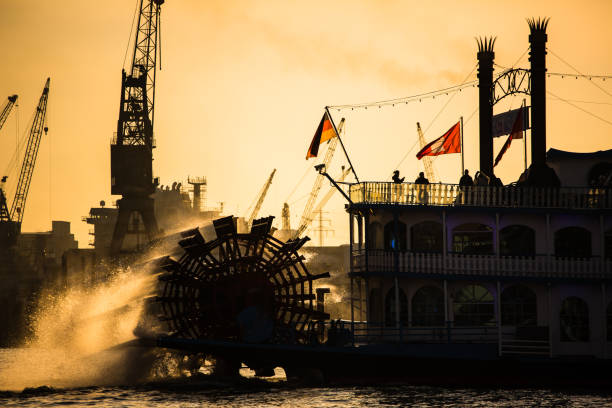 Steam paddle boat in Hamburk, Germany, with a backdrop of a lovely sunset
