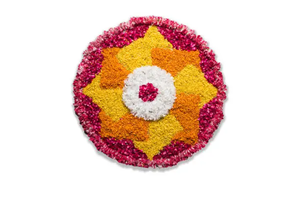 Flower rangoli for Diwali or Pongal or any hindu festival  using marigold or zendu flowers and red rose petals, selective focus