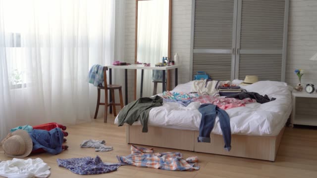 The scene of a messy girl bedroom.