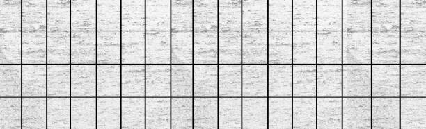 istock Panorama of White modern stone tile wall background and pattern 1024534000