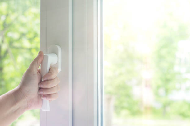 istock To open a window with a mosquito net. Plastic Windows with sunlight background. 1024534318