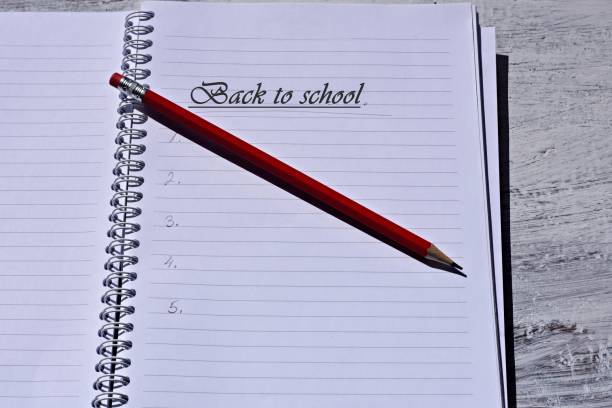 istock Red pencil over open notebook/ Back to school conceptual image 1024534386