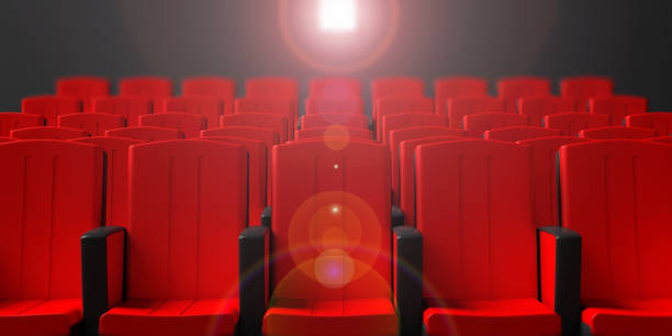 istock Cinema chairs on dark background with projection light, front view. 3d illustration 1024534918