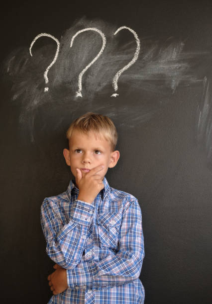 istock European student in a pensive pose near the blackboard 1024537114
