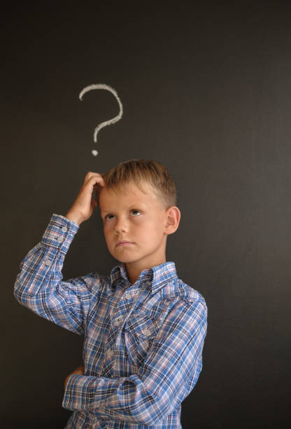 istock European student in a pensive pose near the blackboard 1024537116