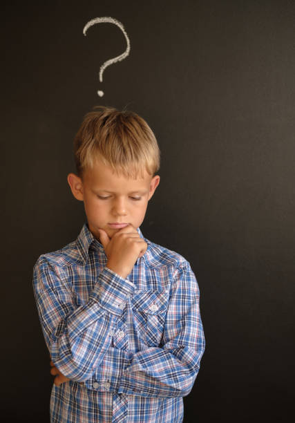 istock European student in a pensive pose near the blackboard 1024537118