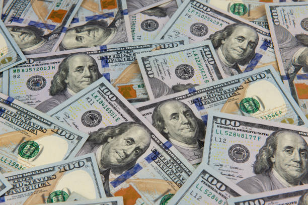 istock One hundred dollar bills as a wallpaper. 1024540712