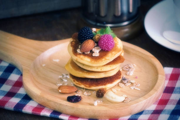 istock Pancake with berries with nut and cereal on wood plate. 1024543148