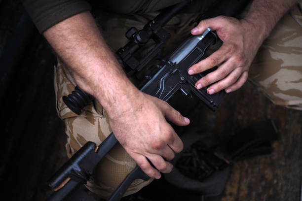 istock soldier hands and Sniper rifle close up. war 1024548736