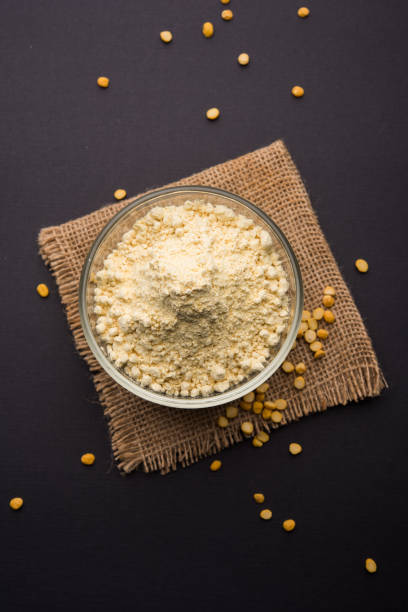 Besan, Gram or chickpea flour is a pulse flour made from a variety of ground chickpea known as Bengal gram. popular ingredient for Pakora/pakoda or bajji snack. Selective focus stock photo