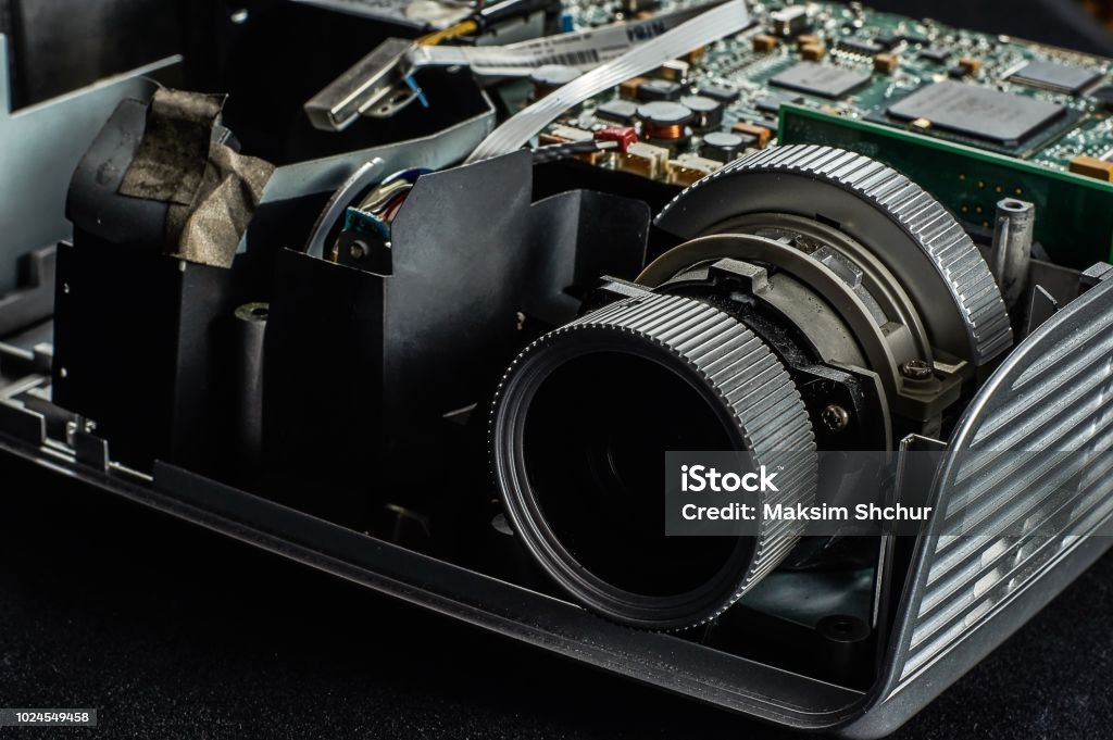 disassembled DLP projector disassembled DLP projector on a black velvet background, front view Projection Equipment Stock Photo
