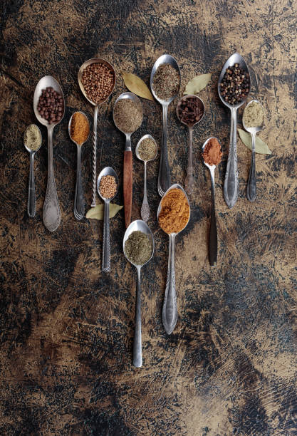 istock Different spices in  spoons on a vintage background. 1024558334