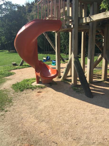 istock wooden and plastic children slide 1024561524
