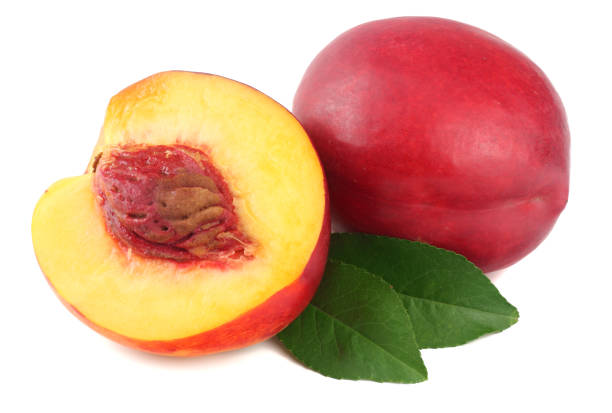istock Nectarine with green leaf and slices isolated on white background 1024563900