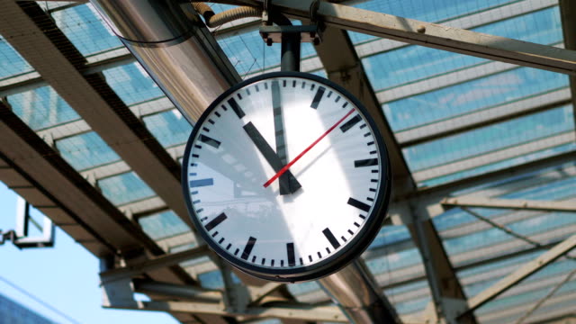 Public clock on the train station in 4k slow motion 60fps