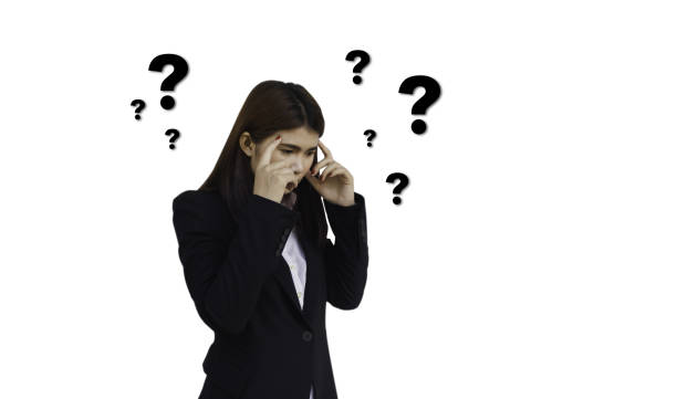 istock Thoughtful young woman with drawn question marks circulating around her head on white background 1024577070