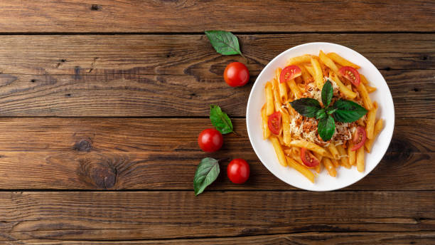 istock Pasta bolognese with tomato sauce and minced meat. Flat lay. Top view. 1024580250
