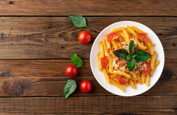 istock Pasta bolognese with tomato sauce and minced meat. Flat lay. Top view. 1024580272