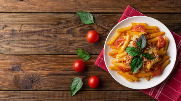 istock Pasta bolognese with tomato sauce and minced meat. Flat lay. Top view. 1024580376
