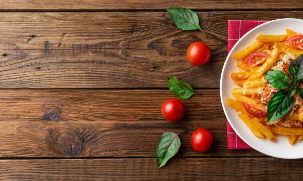 istock Pasta bolognese with tomato sauce and minced meat. Flat lay. Top view. 1024580458