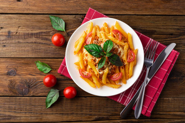 Pasta bolognese with tomato sauce and minced meat. Flat lay. Top view.