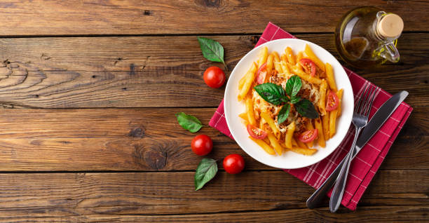 istock Pasta bolognese with tomato sauce and minced meat. Flat lay. Top view. 1024580628