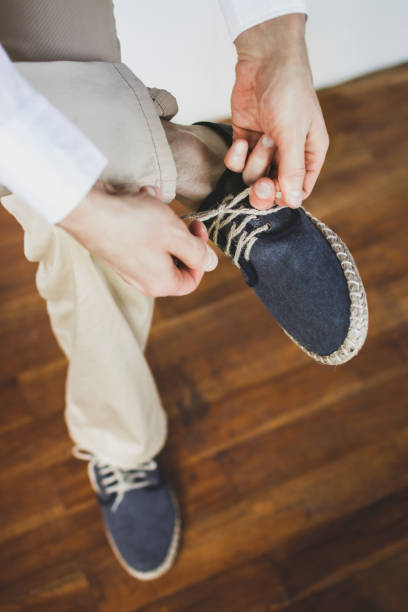 istock Man wearing eco flax blue shoes. Groom getting ready 1024597728