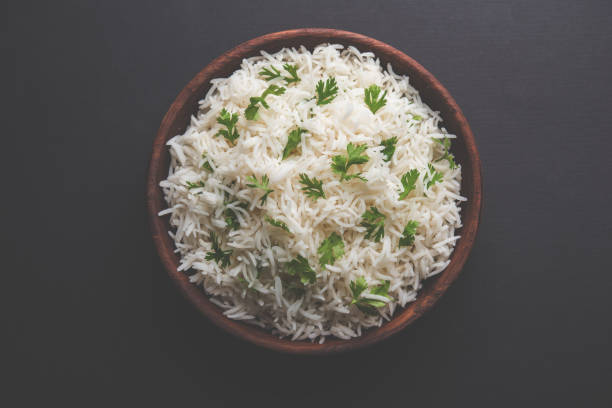 istock Coriander or cilantro Basmati Rice, served in a ceramic or terracotta bowl. It's a popular Indian OR Chinese recipe. Selective focus 1024607366