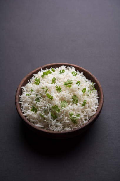 istock Coriander or cilantro Basmati Rice, served in a ceramic or terracotta bowl. It's a popular Indian OR Chinese recipe. Selective focus 1024607456