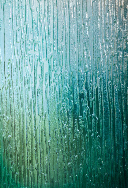 istock Corrugated blue green glass background 1024607510