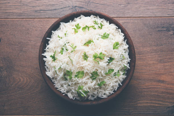 istock Coriander or cilantro Basmati Rice, served in a ceramic or terracotta bowl. It's a popular Indian OR Chinese recipe. Selective focus 1024607630